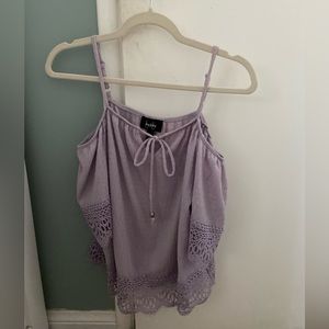 Lavender off-the shoulder blouse with straps.